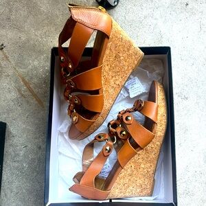 Tan wedge sandals with gold metal studs for added flair
